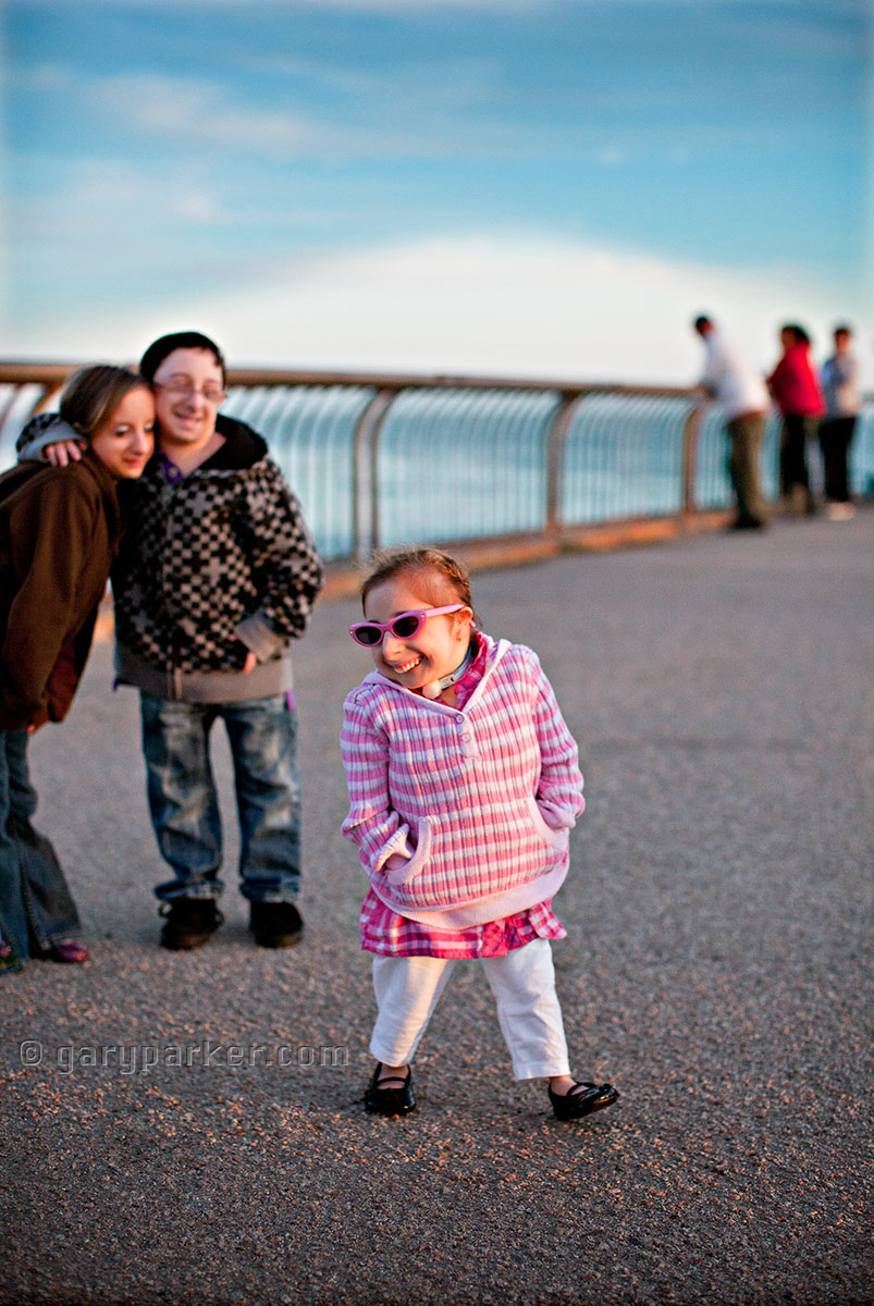 Bridgette Jordan - 23 at this time & the Guinness World Records "World's Smallest Lady" at the beach in Santa Cruz, CA with brother Brad Jordan & Hannah Kritzeck in the background.  All Primordial Dwarfism...